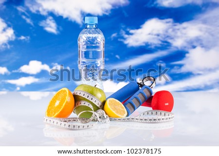 fitness dumbbells, water hand grip and fruits