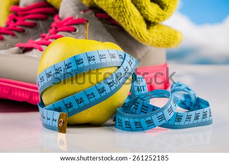 Fitness apple and measure tape composition
