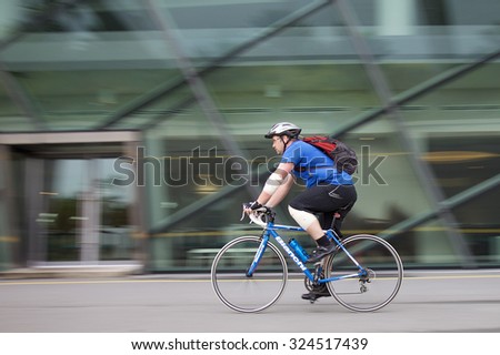Marina bay, Singapore - May 9: Man playing on bike for health. on May 9, 2015 in Marina bay,Singapore.