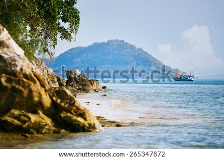View on beautiful island and sea with mountain, tree and frigate