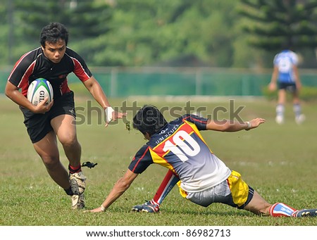 KUALA LUMPUR, MALAYSIA - OCTOBER 15:  Unidentified participants in action during a 10s Rugby Tournament Vice-Chancellor Cup at National Defense University Of Malaysia, Kuala Lumpur, Malaysia on October 15, 2011.