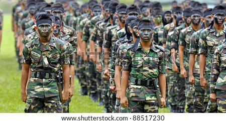 KUALA LUMPUR, MALAYSIA - SEPT. 30: Army Students get ready to perform war dance at Convocation Festival at National Defense University Of Malaysia, Kuala Lumpur, Malaysia on September 30, 2011.