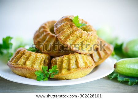 cooked squash cakes with parsley on a plate