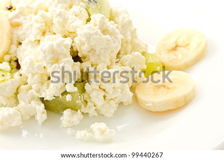 Home milk cheese with fruit on a white background