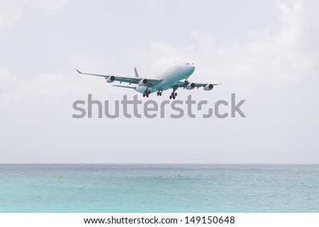 ST MARTIN, ANTILLES - JULY 19: the tourist office and Air France signs an agreement to strengthen their partnership (joint communication plan). Daily A340 about to touch down in July 19. 2013 at SXM.