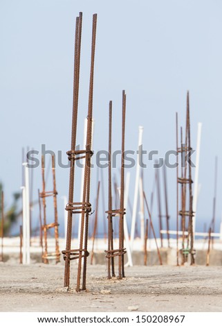 Steel rod or bar used to reinforce concrete, abstract with shallow depth of field