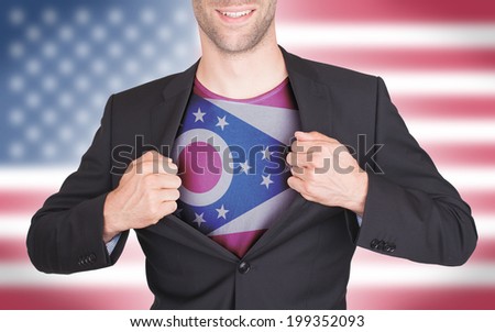 Businessman opening suit to reveal shirt with state flag (USA), Ohio