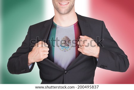 Businessman opening suit to reveal shirt with flag, Japan