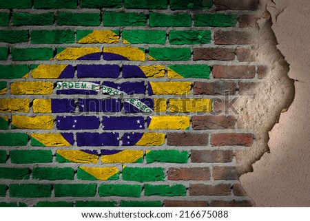 Dark brick wall texture with plaster - flag painted on wall - Brazil