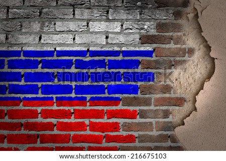 Dark brick wall texture with plaster - flag painted on wall - Russia