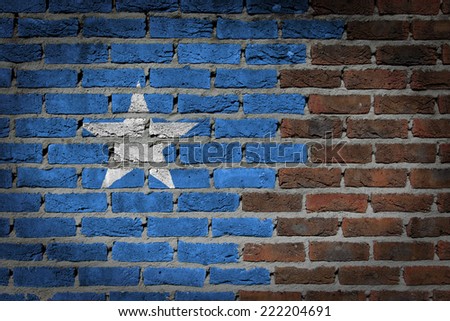 Very old dark red brick wall texture with flag - Somalia