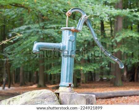 Hand operated water pump, rusted and forgotten