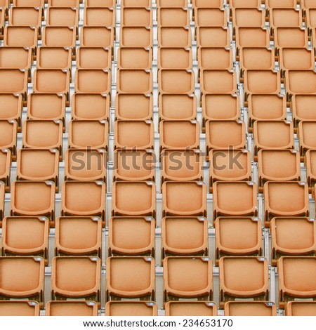 Orange seat in sport stadium, empty seats ready for the public