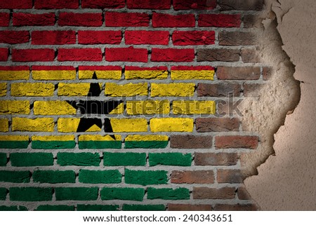 Dark brick wall texture with plaster - flag painted on wall - Ghana