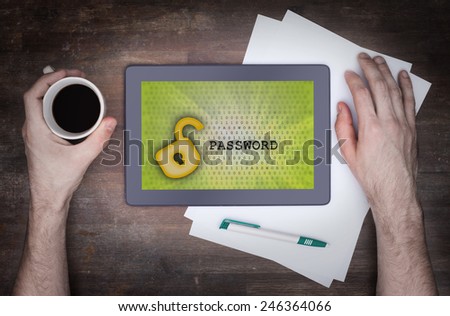 Tablet on a desk, concept of data protection, yellow