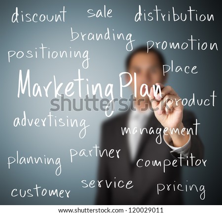 business man writing marketing plan concept
