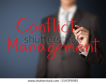 business man writing conflict management