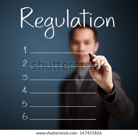 business man writing blank regulation list