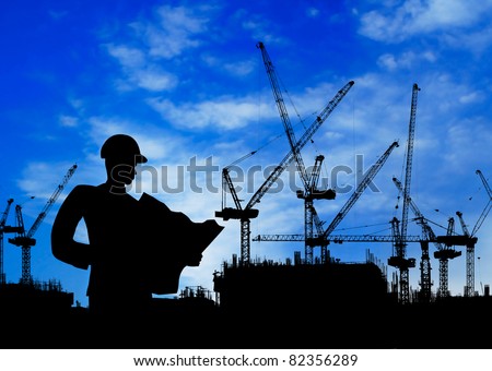 silhouette of an engineer working on construction site at day time