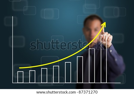 business man pointing at upward trend graph