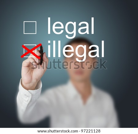 businessman writing red check mark for illegal selection