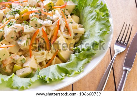 Fresh vegetable salad with potato, pasta, shrimps and red pepper