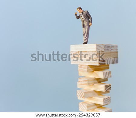risk manager standing on the top and looking down, with copy space for any text