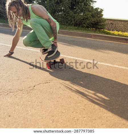 teenager riding skateboard longboard by road outdoor at mountain