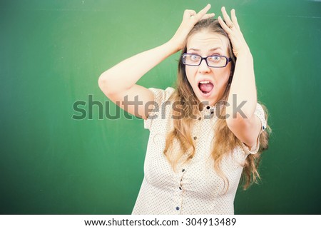 Teacher woman in stress or depression at school classroom, children or students driving her crazy.