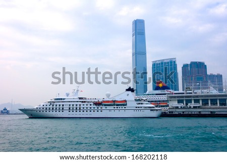 HONG KONG, CHINA - DEC 9: Big Cruise Ship berth at Victoria Harbor on December 9, 2013 in Hong Kong, China. Hongkong is a major tourist city in Asia,More than 40,000,000 visitors a year