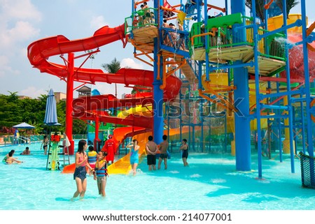 GUANGZHOU, CHINA - AUG 30: visitors in the chimelong water park on Aug 30, 2014 in Guangzhou. Chimelong Waterpark is the largest waterpark in the world.
