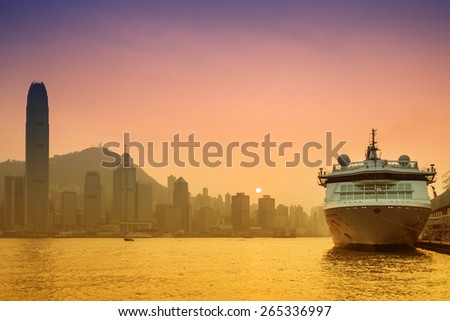 HONG KONG, CHINA - NOV 19: Big Cruise Ship berth at Victoria Harbor on Nov 19, 2014 in Hong Kong, Hongkong is a major tourist city in Asia,More than 40000000 visitors a year.