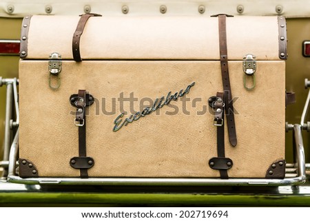RONNEBY, SWEDEN - JUNE 28, 2014: Nostalgia Festival with classic cars and motorcycles as main attractions. Excalibur chest or trunk in beige leather with straps.
