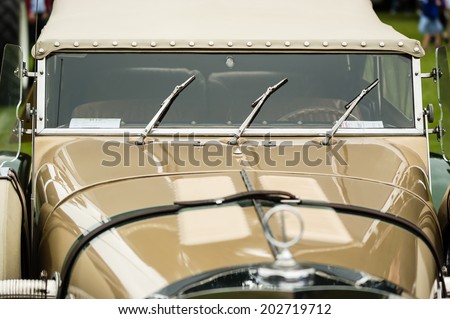 RONNEBY, SWEDEN - JUNE 28, 2014: Nostalgia Festival with classic cars and motorcycles as main attractions. Excalibur windshield wipers, hood and front out of focus.