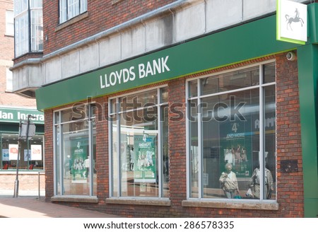 Cheshire, UK- June 4th 2015: Lloyds bank branch with sign and logo.  Lloyds Bank has been hit with record fines after the PPI mis selling scandal in the UK.