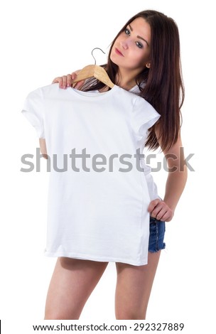Girl tries on white T-shirt mock-up isolated on white