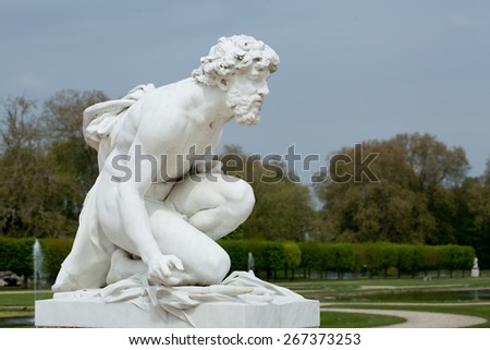 white marble statue of men in park