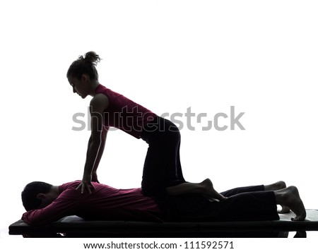 one man and woman perfoming thai massage in silhouette studio on white background