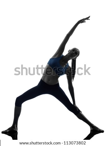 one caucasian woman exercising stretching triangle pose yoga in silhouette studio isolated on white background