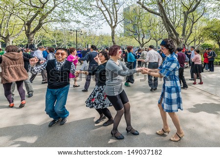 SHANGHAI - APRIL 7: group of people dancing in fuxing park on april 7th, 2013 in Shanghai