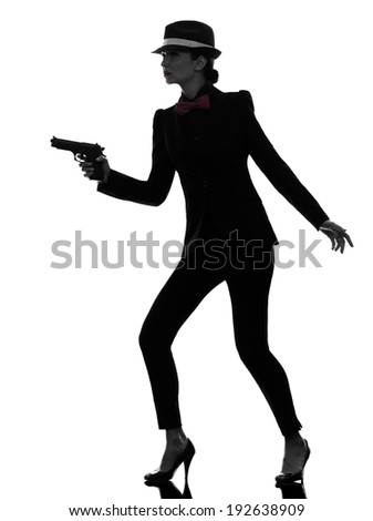 one stylish  woman in suit holding gun in silhouette on white background