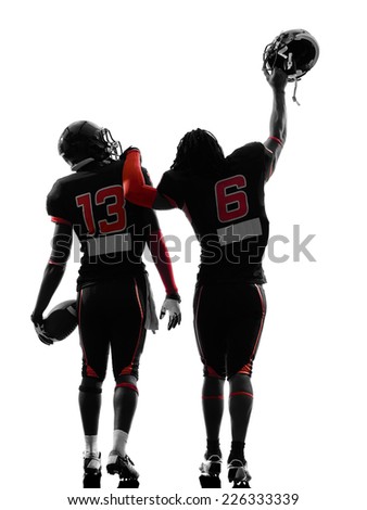 two american football players walking,rear view in silhouette shadow on white background