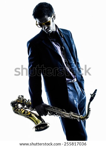 one caucasian man  saxophonist playing saxophone player in studio silhouette isolated on white background