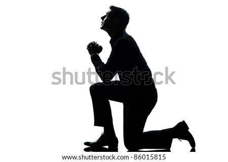 One Caucasian Man Kneeling Praying Full Length Silhouette In Studio ...