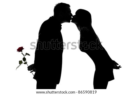 One Caucasian Couple Man And Woman Kissing In Studio Silhouette ...