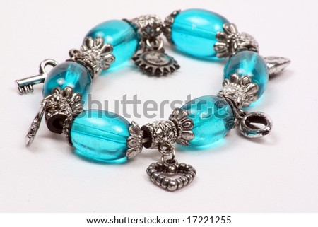 A beautiful bracelet with blue beads and ethnic Indian design.