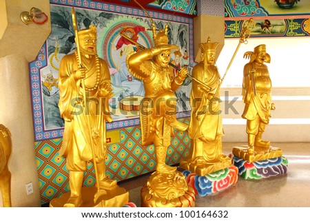 Chinese statue a priest and members of 