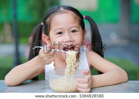 Similar – Image, Stock Photo portrait adorable child eating chocolate sponge cake