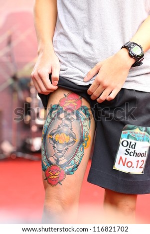 BANGKOK, THAILAND - OCTOBER 23 : Unidentified Thai people show old school tattoos at MBK Center on display 