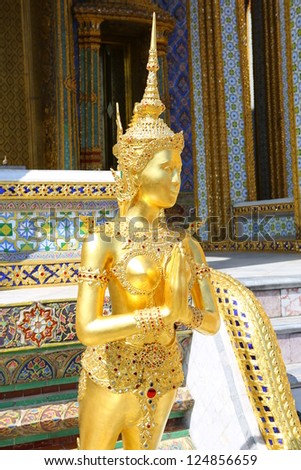BANGKOK, THAILAND - JANUARY 14 : Golden Kinnaree traditional greeting gesture (sawasdee) on display at wat pra kaew on January 14, 2013 in Bangkok, Thailand.